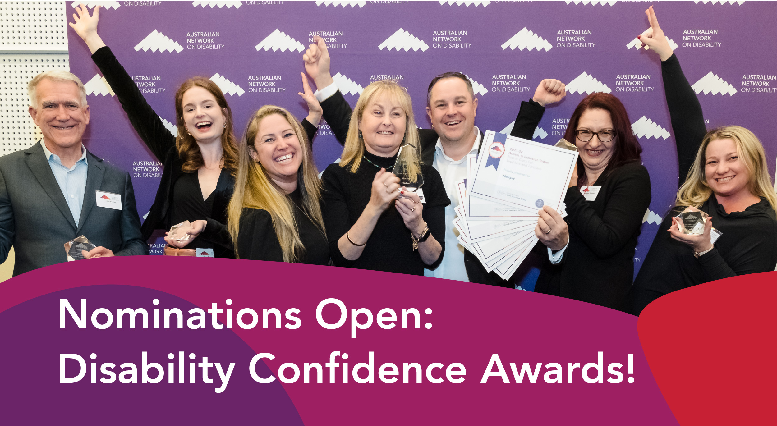 Nominations Open: Disability Confidence Awards! Westpac team holding their awards, with their hands up celebrating. 